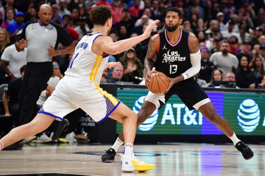 Dec 2, 2023; Los Angeles, California, USA; Los Angeles Clippers forward Paul George (13) controls the ball against Golden State Warriors guard Klay Thompson (11) during the second half at Crypto.com Arena. Mandatory Credit: Gary A. Vasquez-Imagn Images