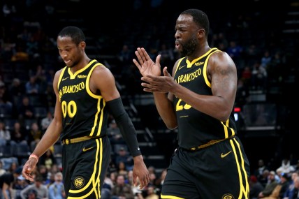 Jan 15, 2024; Memphis, Tennessee, USA; Golden State Warriors forward Jonathan Kuminga (00) and Golden State Warriors forward Draymond Green (23) walk to the bench at the end of the first quarter against the Memphis Grizzlies  at FedExForum. Mandatory Credit: Petre Thomas-Imagn Images