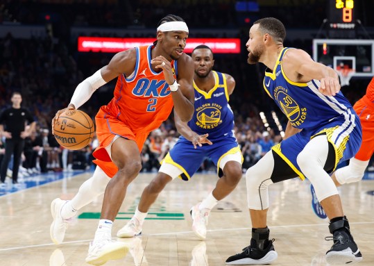 Nov 10, 2024; Oklahoma City, Oklahoma, USA; Oklahoma City Thunder guard Shai Gilgeous-Alexander (2) drives to the basket against Golden State Warriors guard Stephen Curry (30) during the second quarter at Paycom Center. Mandatory Credit: Alonzo Adams-Imagn Images