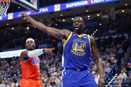 Nov 10, 2024; Oklahoma City, Oklahoma, USA; Golden State Warriors forward Draymond Green (23) and Oklahoma City Thunder guard Luguentz Dort (5) react after a play during the second quarter at Paycom Center. Mandatory Credit: Alonzo Adams-Imagn Images