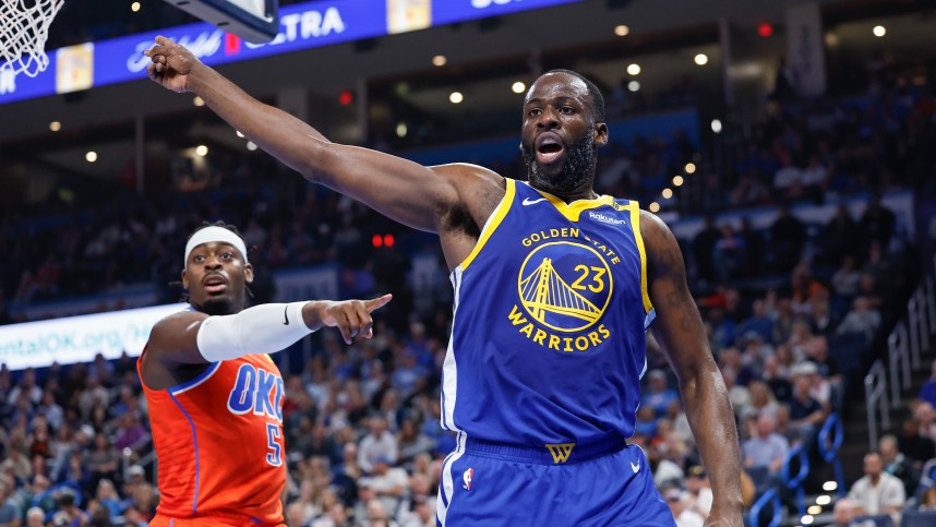 Nov 10, 2024; Oklahoma City, Oklahoma, USA; Golden State Warriors forward Draymond Green (23) and Oklahoma City Thunder guard Luguentz Dort (5) react after a play during the second quarter at Paycom Center. Mandatory Credit: Alonzo Adams-Imagn Images