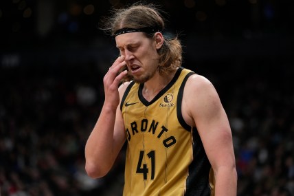 Mar 1, 2024; Toronto, Ontario, CAN; Toronto Raptors forward Kelly Olynyk (41) reacts after being poked in the eye by a Golden State Warriors player during the second half at Scotiabank Arena. Mandatory Credit: John E. Sokolowski-Imagn Images