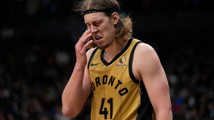 Mar 1, 2024; Toronto, Ontario, CAN; Toronto Raptors forward Kelly Olynyk (41) reacts after being poked in the eye by a Golden State Warriors player during the second half at Scotiabank Arena. Mandatory Credit: John E. Sokolowski-Imagn Images