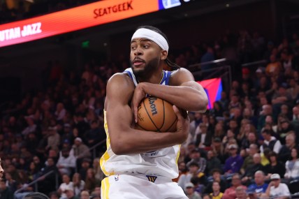 Oct 25, 2024; Salt Lake City, Utah, USA; Golden State Warriors guard Moses Moody (4) wraps up a rebound against the Utah Jazz during the fourth quarter at Delta Center. Mandatory Credit: Rob Gray-Imagn Images