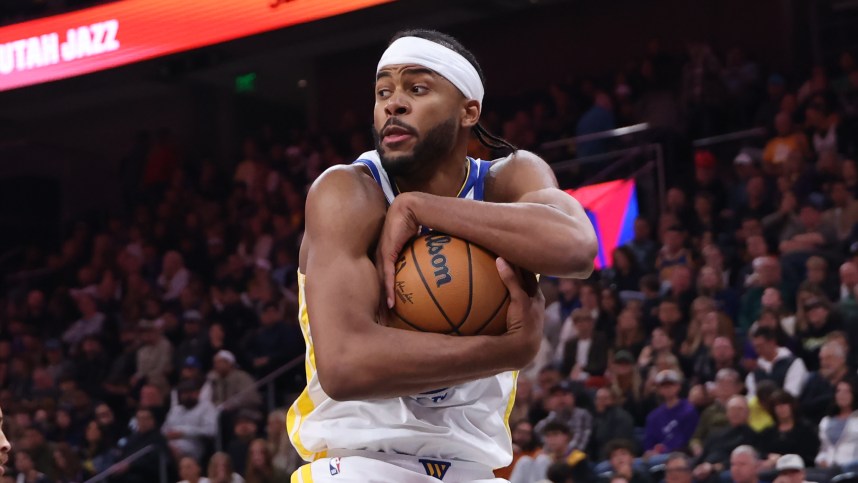 Oct 25, 2024; Salt Lake City, Utah, USA; Golden State Warriors guard Moses Moody (4) wraps up a rebound against the Utah Jazz during the fourth quarter at Delta Center. Mandatory Credit: Rob Gray-Imagn Images