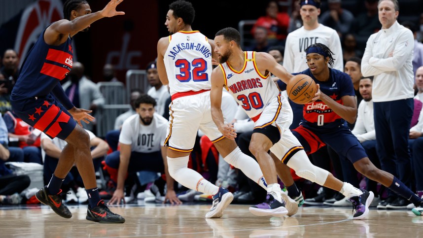 Nov 4, 2024; Washington, District of Columbia, USA; Golden State Warriors guard Stephen Curry (30) dribbles the ball past Washington Wizards guard Bilal Coulibaly (0) in the first half at Capital One Arena. Mandatory Credit: Geoff Burke-Imagn Images