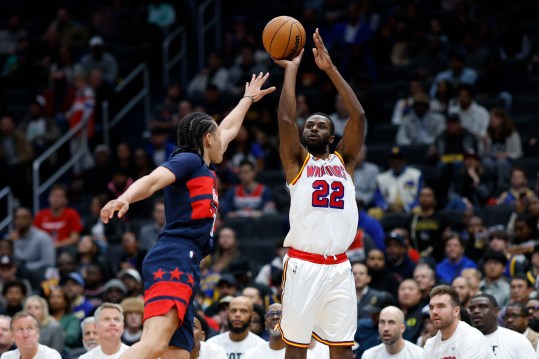 Nov 4, 2024; Washington, District of Columbia, USA; Golden State Warriors forward Andrew Wiggins (22) shoots the ball over Washington Wizards forward Kyshawn George (18) in the second half at Capital One Arena. Mandatory Credit: Geoff Burke-Imagn Images