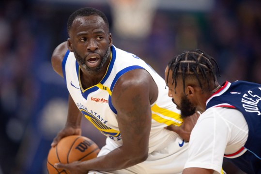 October 27, 2024; San Francisco, California, United States; Golden State Warriors forward Draymond Green (left) waits to pass by Los Angeles Clippers forward Derrick Jones Jr. (55) during the first quarter at Chase Center. Mandatory Credit: D. Ross Cameron-Imagn Images