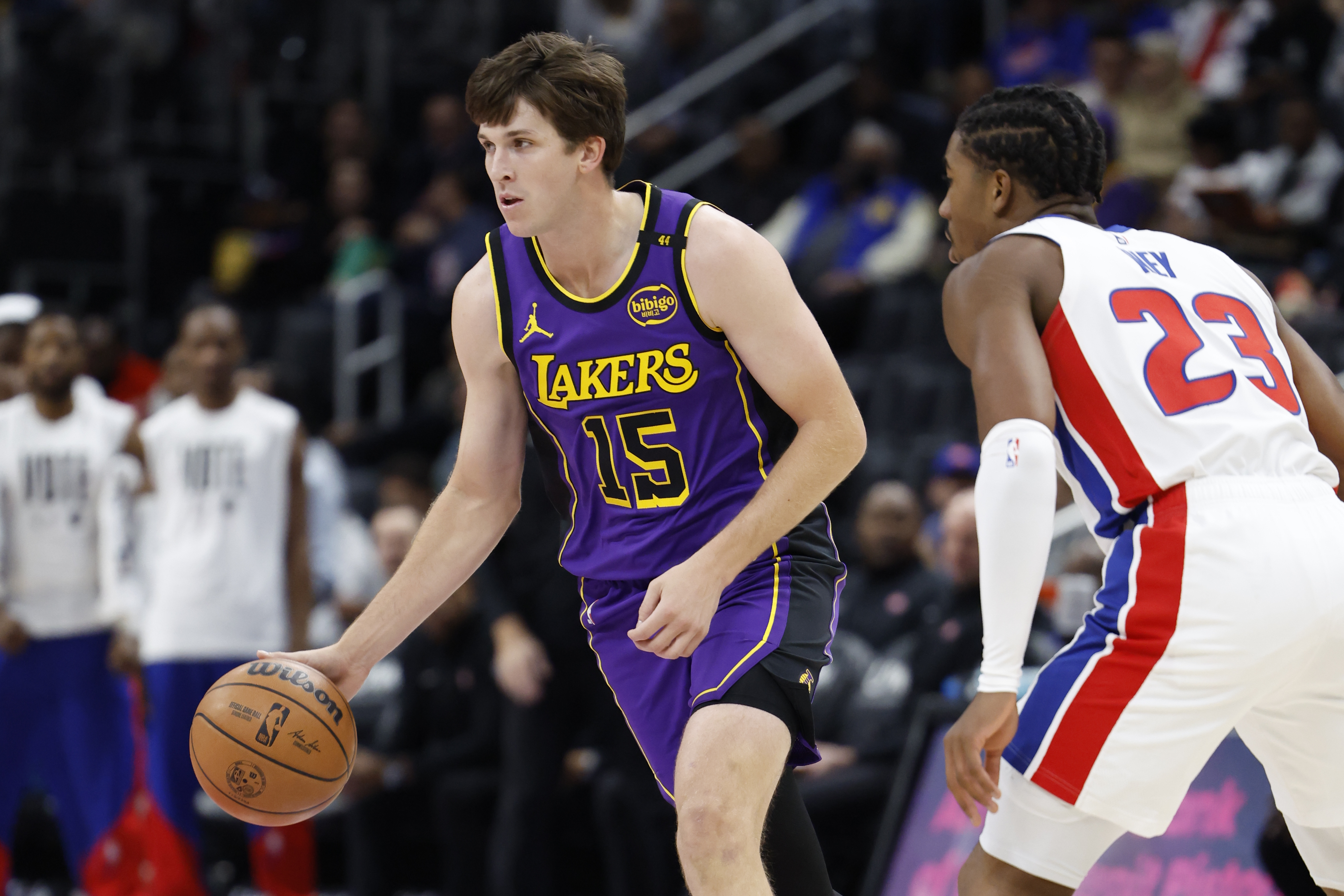 Nov 4, 2024; Detroit, Michigan, USA; Los Angeles Lakers guard Austin Reaves (15) dribbles defended by Detroit Pistons guard Jaden Ivey (23) in the first half at Little Caesars Arena. Mandatory Credit: Rick Osentoski-Imagn Images