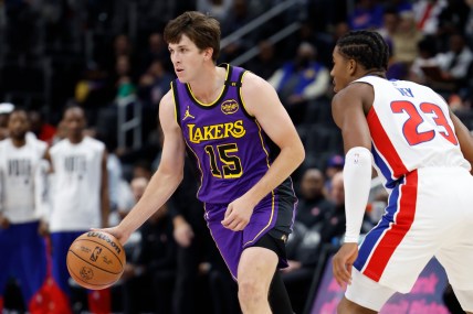 Nov 4, 2024; Detroit, Michigan, USA; Los Angeles Lakers guard Austin Reaves (15) dribbles defended by Detroit Pistons guard Jaden Ivey (23) in the first half at Little Caesars Arena. Mandatory Credit: Rick Osentoski-Imagn Images