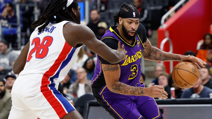 Nov 4, 2024; Detroit, Michigan, USA; Los Angeles Lakers forward Anthony Davis (3) dribbles defended by Detroit Pistons center Isaiah Stewart (28) in the first half at Little Caesars Arena. Mandatory Credit: Rick Osentoski-Imagn Images