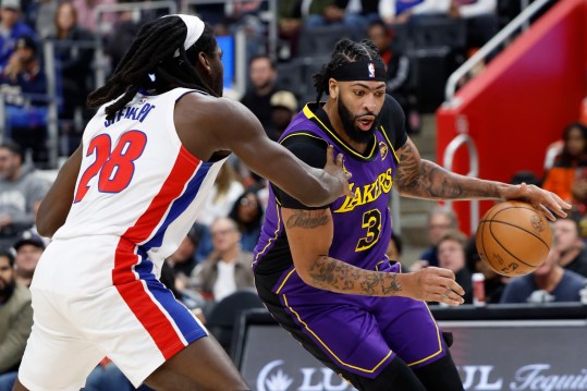 Nov 4, 2024; Detroit, Michigan, USA; Los Angeles Lakers forward Anthony Davis (3) dribbles defended by Detroit Pistons center Isaiah Stewart (28) in the first half at Little Caesars Arena. Mandatory Credit: Rick Osentoski-Imagn Images