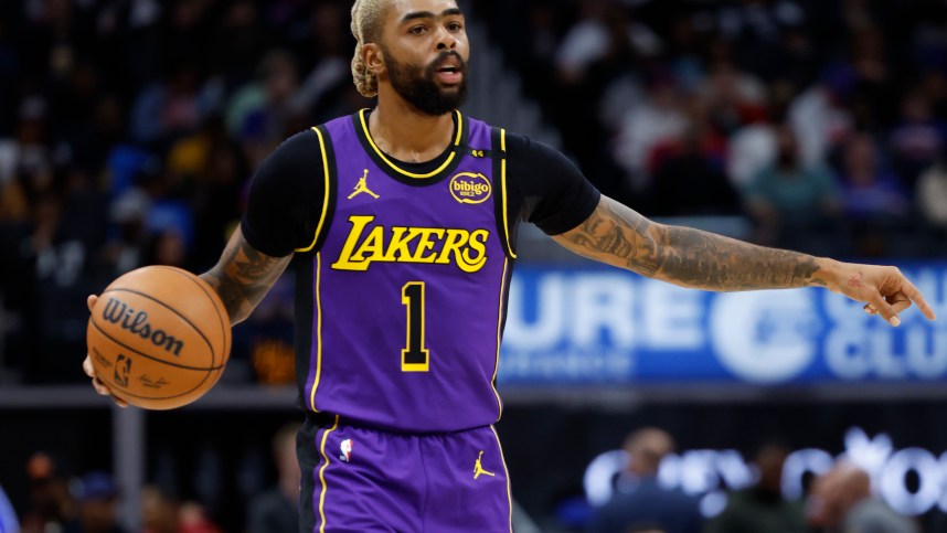 Nov 4, 2024; Detroit, Michigan, USA; Los Angeles Lakers guard D'Angelo Russell (1) dribbles in the first half against the Detroit Pistons at Little Caesars Arena. Mandatory Credit: Rick Osentoski-Imagn Images