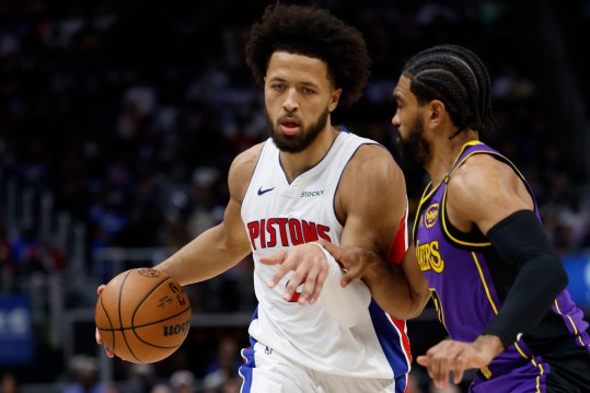 Nov 4, 2024; Detroit, Michigan, USA;  Detroit Pistons guard Cade Cunningham (2) dribbles defended by Los Angeles Lakers guard Gabe Vincent (7) in the second half at Little Caesars Arena. Mandatory Credit: Rick Osentoski-Imagn Images