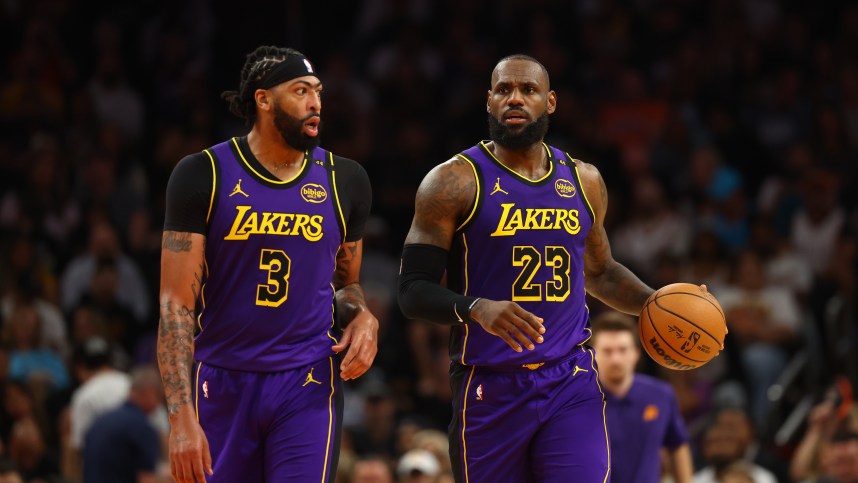 Oct 28, 2024; Phoenix, Arizona, USA; Los Angeles Lakers forward LeBron James (23) and forward Anthony Davis (3) against the Phoenix Suns at Footprint Center. Mandatory Credit: Mark J. Rebilas-Imagn Images