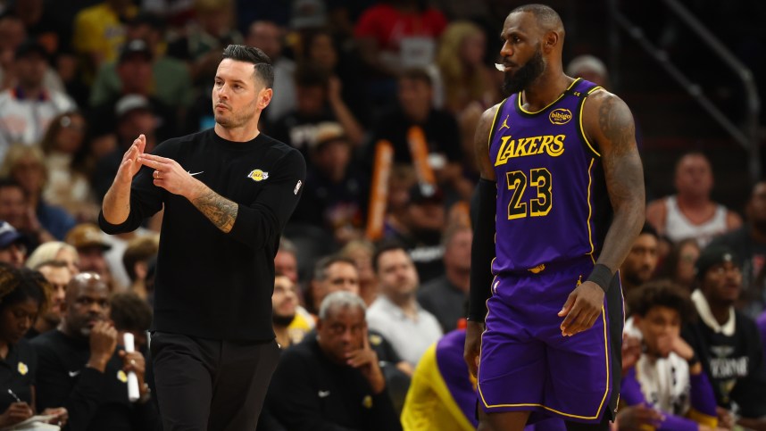 Oct 28, 2024; Phoenix, Arizona, USA; Los Angeles Lakers head coach JJ Redick with forward LeBron James (23) against the Phoenix Suns at Footprint Center. Mandatory Credit: Mark J. Rebilas-Imagn Images