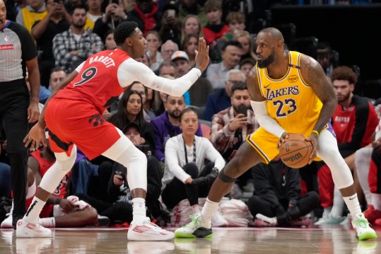 Nov 1, 2024; Toronto, Ontario, CAN; Toronto Raptors guard RJ Barrett (9) defends against Los Angeles Lakers forward LeBron James (23) during the second half at Scotiabank Arena. Mandatory Credit: John E. Sokolowski-Imagn Images