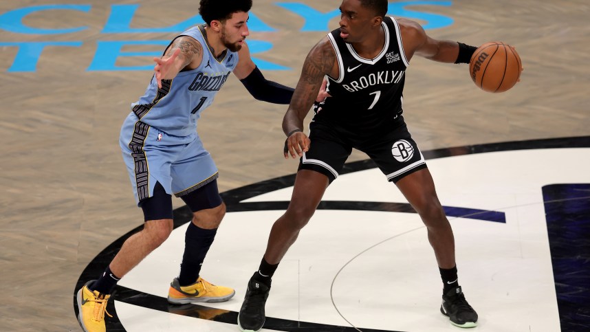 Nov 4, 2024; Brooklyn, New York, USA; Brooklyn Nets guard Shake Milton (7) controls the ball against Memphis Grizzlies guard Scotty Pippen Jr. (1) during the fourth quarter at Barclays Center. Mandatory Credit: Brad Penner-Imagn Images