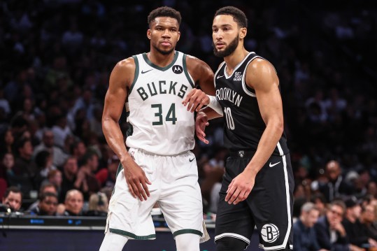 Oct 27, 2024; Brooklyn, New York, USA;  Milwaukee Bucks forward Giannis Antetokounmpo (34) and Brooklyn Nets guard Ben Simmons (10) check back into the game in the third quarter at Barclays Center. Mandatory Credit: Wendell Cruz-Imagn Images