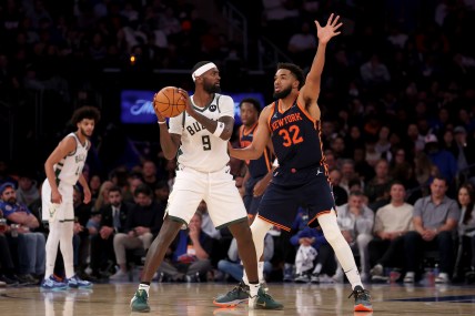 Nov 8, 2024; New York, New York, USA; Milwaukee Bucks forward Bobby Portis (9) looks to pass the ball against New York Knicks center Karl-Anthony Towns (32) during the fourth quarter at Madison Square Garden. Mandatory Credit: Brad Penner-Imagn Images