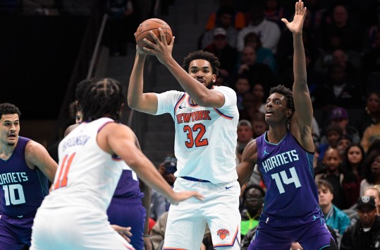 Nov 29, 2024; Charlotte, North Carolina, USA; New York Knicks center Karl-Anthony Towns (32) looks to pass to guard Jalen Brunson (11) during the second half aagainst the Charlotte Hornets the Spectrum Center. Mandatory Credit: Sam Sharpe-Imagn Images