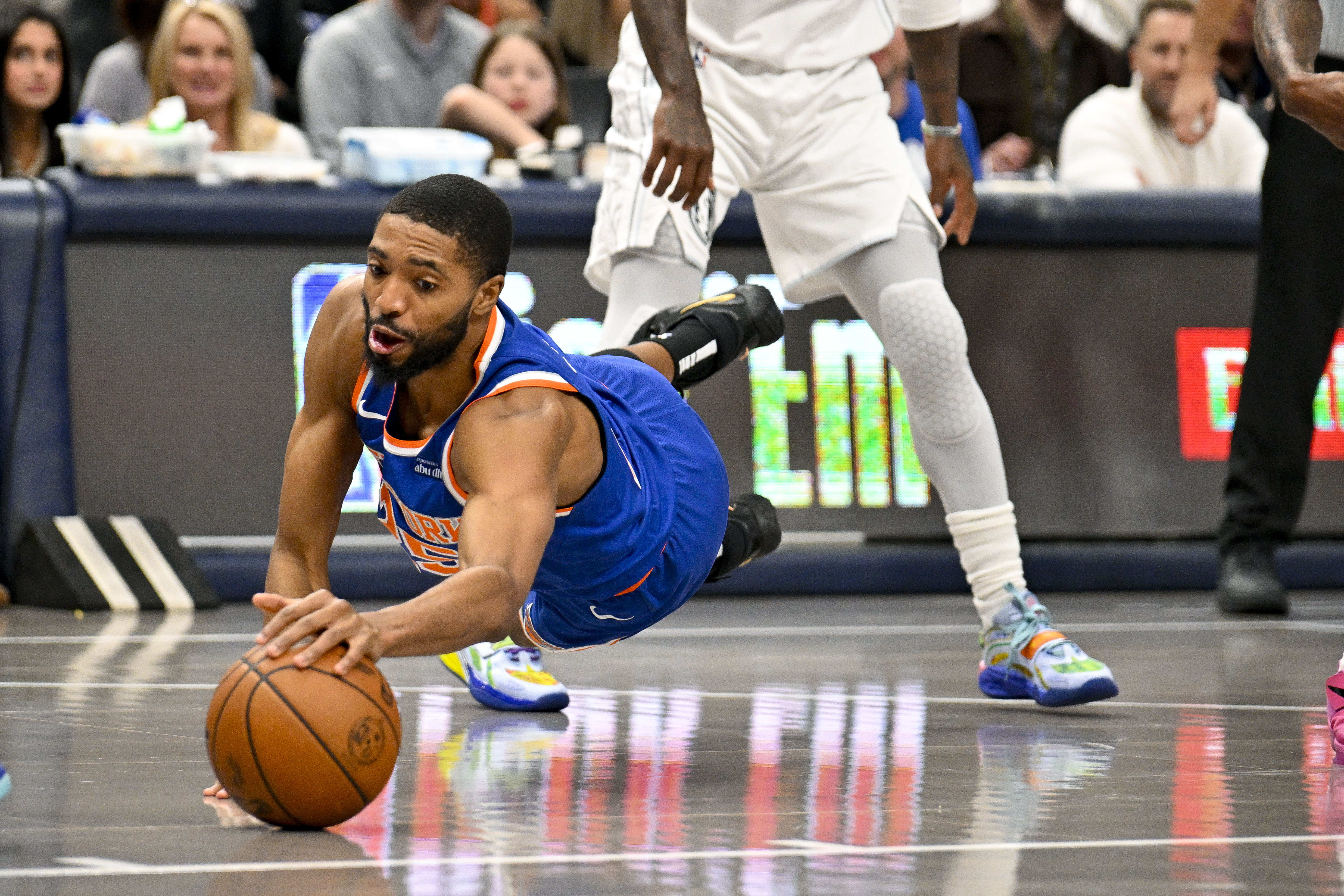 Nov 27, 2024; Dallas, Texas, USA; New York Knicks forward Mikal Bridges (25) dives for the ball during the first quarter against the Dallas Mavericks at the American Airlines Center. Mandatory Credit: Jerome Miron-Imagn Images