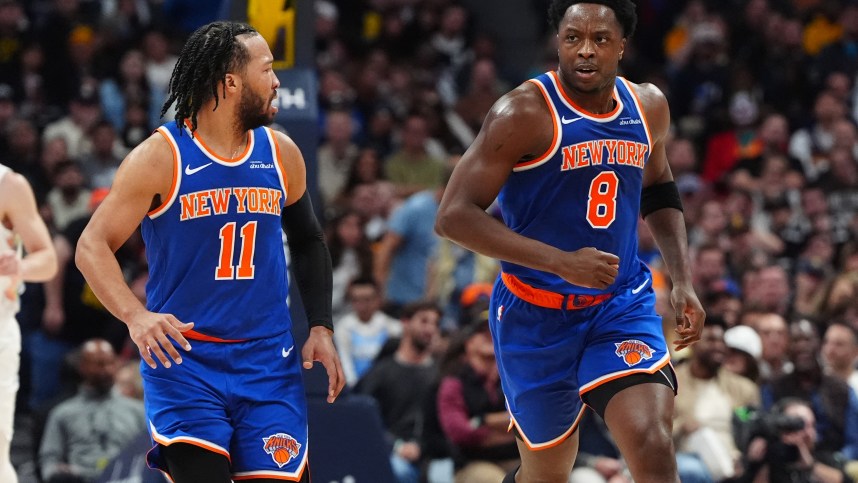 Nov 25, 2024; Denver, Colorado, USA; New York Knicks guard Jalen Brunson (11) reacts towards forward OG Anunoby (8) in the second quarter against the Denver Nuggets at Ball Arena. Mandatory Credit: Ron Chenoy-Imagn Images