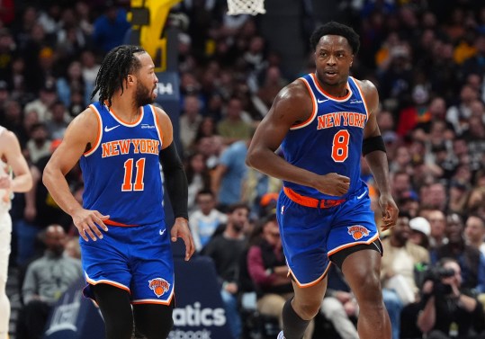 Nov 25, 2024; Denver, Colorado, USA; New York Knicks guard Jalen Brunson (11) reacts towards forward OG Anunoby (8) in the second quarter against the Denver Nuggets at Ball Arena. Mandatory Credit: Ron Chenoy-Imagn Images