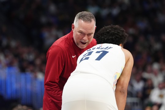 Nov 25, 2024; Denver, Colorado, USA; Denver Nuggets head coach Michael Malone talks to guard Jamal Murray (27) during the second quarter against the New York Knicks at Ball Arena. Mandatory Credit: Ron Chenoy-Imagn Images