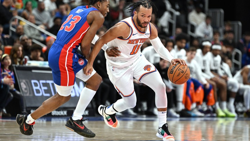 Nov 1, 2024; Detroit, Michigan, USA; New York Knicks guard Jalen Brunson (11) drive past Detroit Pistons guard Jaden Ivey (23) in the third quarter at Little Caesars Arena. Mandatory Credit: Lon Horwedel-Imagn Images