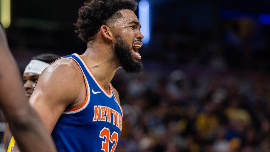 Nov 10, 2024; Indianapolis, Indiana, USA; New York Knicks center Karl-Anthony Towns (32) reacts to an and one basket in the second half against the Indiana Pacers at Gainbridge Fieldhouse. Mandatory Credit: Trevor Ruszkowski-Imagn Images