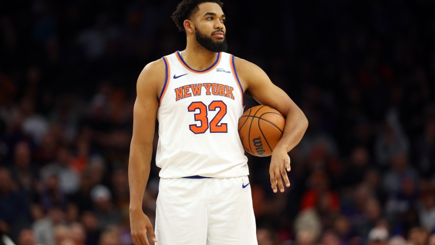 Nov 20, 2024; Phoenix, Arizona, USA; New York Knicks center Karl-Anthony Towns (32) against the Phoenix Suns at Footprint Center. Mandatory Credit: Mark J. Rebilas-Imagn Images