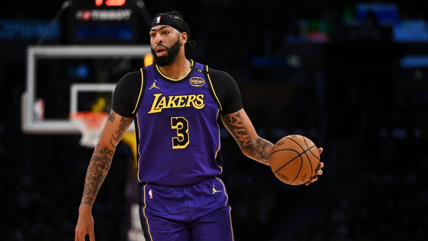 Oct 25, 2024; Los Angeles, California, USA; Los Angeles Lakers forward Anthony Davis (3) looks to pass against the Phoenix Suns during the first half at Crypto.com Arena. Mandatory Credit: Jonathan Hui-Imagn Images