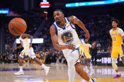 Oct 18, 2024; San Francisco, California, USA; Golden State Warriors guard De'Anthony Melton (8) runs down a loose ball against the Los Angeles Lakers in the first quarter at the Chase Center. Mandatory Credit: Cary Edmondson-Imagn Images