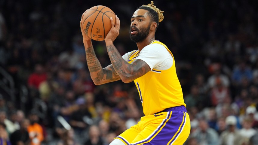 October 17, 2024; Phoenix, Arizona, USA; Los Angeles Lakers guard D'Angelo Russell (1) shoots during the second half against the Phoenix Suns at Footprint Center. Mandatory credits: Joe Camporeale-Imagn Images