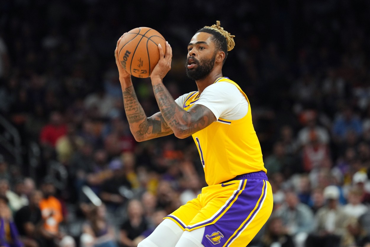 Oct 17, 2024; Phoenix, Arizona, USA; Los Angeles Lakers guard D'Angelo Russell (1) shoots against the Phoenix Suns during the second half at Footprint Center. Mandatory Credit: Joe Camporeale-Imagn Images