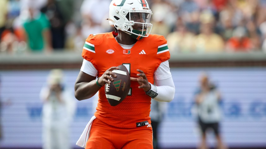 Nov 9, 2024; Atlanta, Georgia, USA; Miami Hurricanes quarterback Cam Ward (1) drops back to pass against the Georgia Tech Yellow Jackets in the third quarter at Bobby Dodd Stadium at Hyundai Field. Mandatory Credit: Brett Davis-Imagn Images