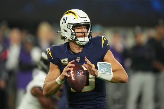 Nov 25, 2024; Inglewood, California, USA; Los Angeles Chargers quarterback Justin Herbert (10) throws the ball against the Baltimore Ravens in the first half at SoFi Stadium. Mandatory Credit: Kirby Lee-Imagn Images