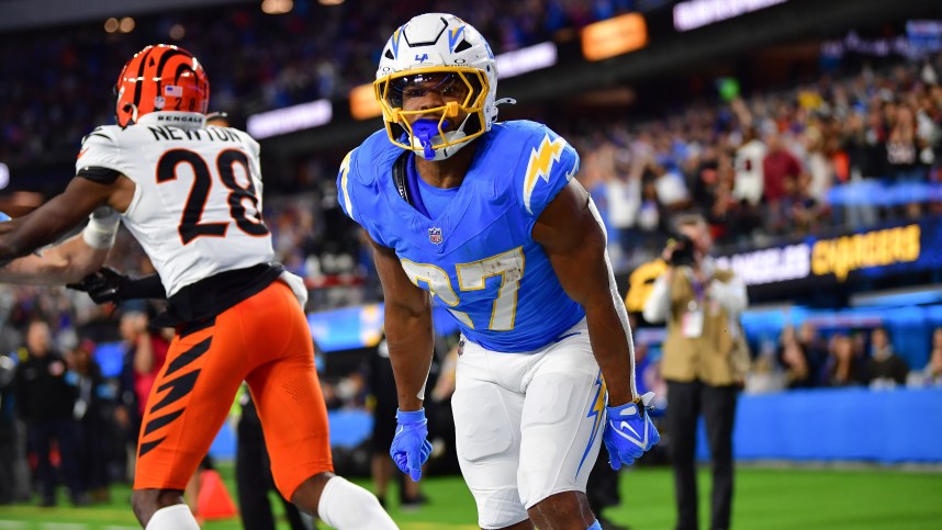 Nov 17, 2024; Inglewood, California, USA; Los Angeles Chargers running back J.K. Dobbins (27) celebrates his touchdown scored against the Cincinnati Bengals during the second half at SoFi Stadium. Mandatory Credit: Gary A. Vasquez-Imagn Images