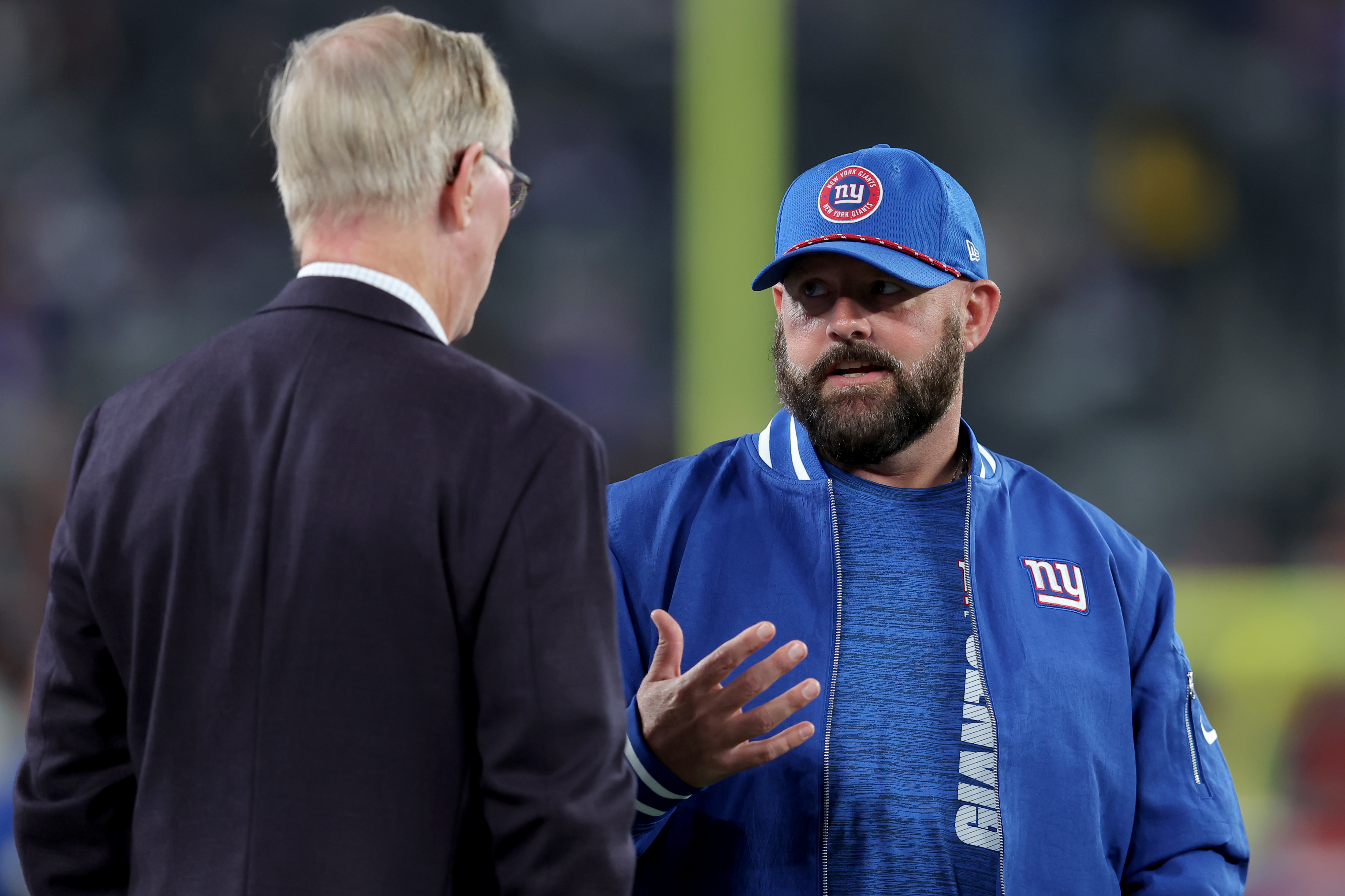 Oct 13, 2024; East Rutherford, New Jersey, USA; New York Giants head coach Brian Daboll talks to co-owner John Mara before a game against the Cincinnati Bengals at MetLife Stadium. Mandatory Credit: Brad Penner-Imagn Images