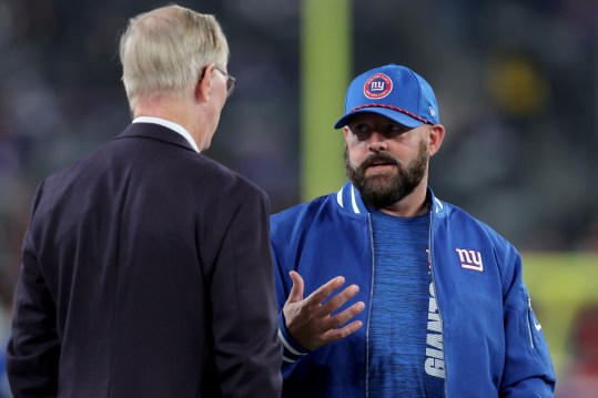 Oct 13, 2024; East Rutherford, New Jersey, USA; New York Giants head coach Brian Daboll talks to co-owner John Mara before a game against the Cincinnati Bengals at MetLife Stadium. Mandatory Credit: Brad Penner-Imagn Images