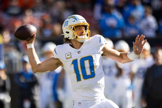 Nov 3, 2024; Cleveland, Ohio, USA; Los Angeles Chargers quarterback Justin Herbert (10) throws the ball against the Cleveland Browns during the second quarter at Huntington Bank Field. Mandatory Credit: Scott Galvin-Imagn Images