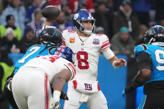 Nov 10, 2024; Munich, Germany; New York Giants quarterback Daniel Jones (8) throws the ball against the Carolina Panthers in the first half during the 2024 NFL Munich Game at Allianz Arena. Mandatory Credit: Kirby Lee-Imagn Images