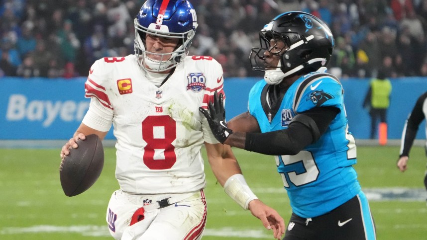 Nov 10, 2024; Munich, Germany; Carolina Panthers cornerback Jaycee Horn (8) carries the ball against Carolina Panthers safety Xavier Woods (25) in the second half during the 2024 NFL Munich Game at Allianz Arena. Mandatory Credit: Kirby Lee-Imagn Images