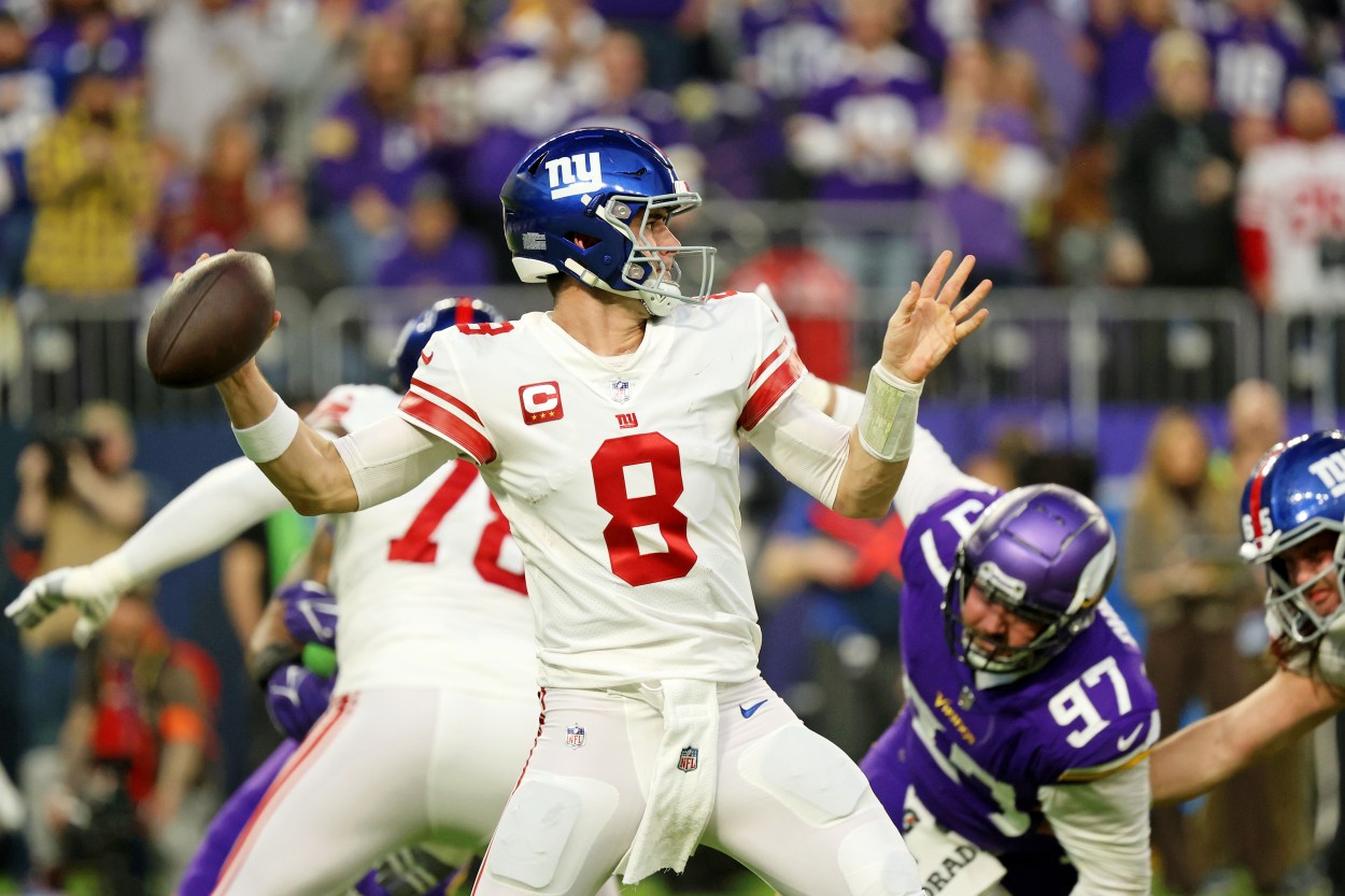 Jan 15, 2023; Minneapolis, Minnesota, USA; New York Giants quarterback Daniel Jones (8) passes the ball against the Minnesota Vikings during the first quarter of a wild card game at U.S. Bank Stadium. Mandatory Credit: Matt Krohn-Imagn Images