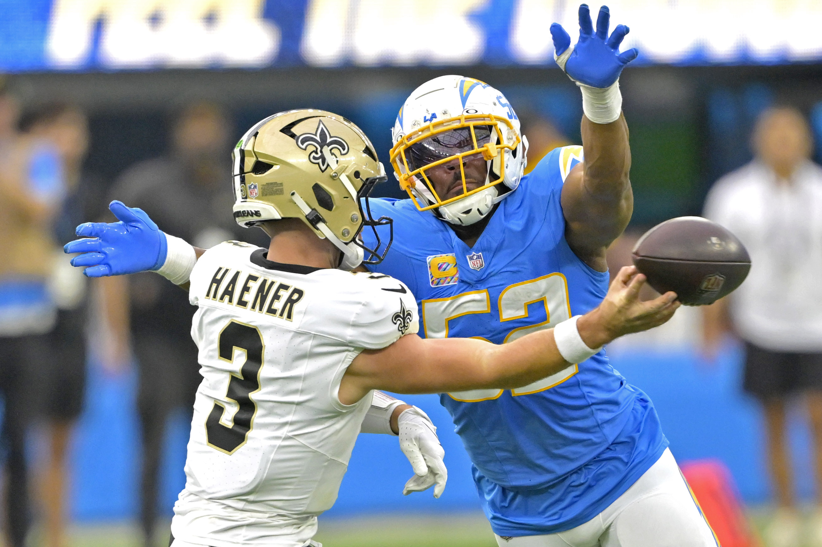 Oct 27, 2024; Inglewood, California, USA;  Los Angeles Chargers linebacker Khalil Mack (52) forces New Orleans Saints quarterback Jake Haener (3) to throw an incomplete pass in the second half at SoFi Stadium. Mandatory Credit: Jayne Kamin-Oncea-Imagn Images