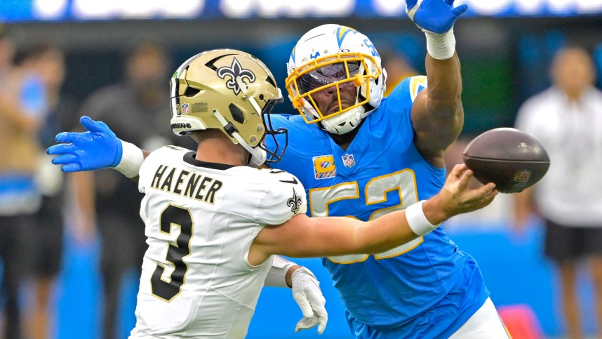 Oct 27, 2024; Inglewood, California, USA;  Los Angeles Chargers linebacker Khalil Mack (52) forces New Orleans Saints quarterback Jake Haener (3) to throw an incomplete pass in the second half at SoFi Stadium. Mandatory Credit: Jayne Kamin-Oncea-Imagn Images