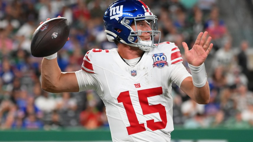 Aug 24, 2024; East Rutherford, New Jersey, USA; New York Giants quarterback Tommy DeVito (15) passes the ball against the New York Jets during the second half at MetLife Stadium. Mandatory Credit: Rich Barnes-Imagn Images