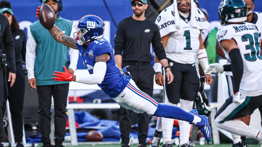 Oct 20, 2024; East Rutherford, New Jersey, USA; New York Giants wide receiver Jalin Hyatt (13) attempts to catch a pass in front of Philadelphia Eagles safety Tristin McCollum (36) during the second half at MetLife Stadium. Mandatory Credit: Vincent Carchietta-Imagn Images