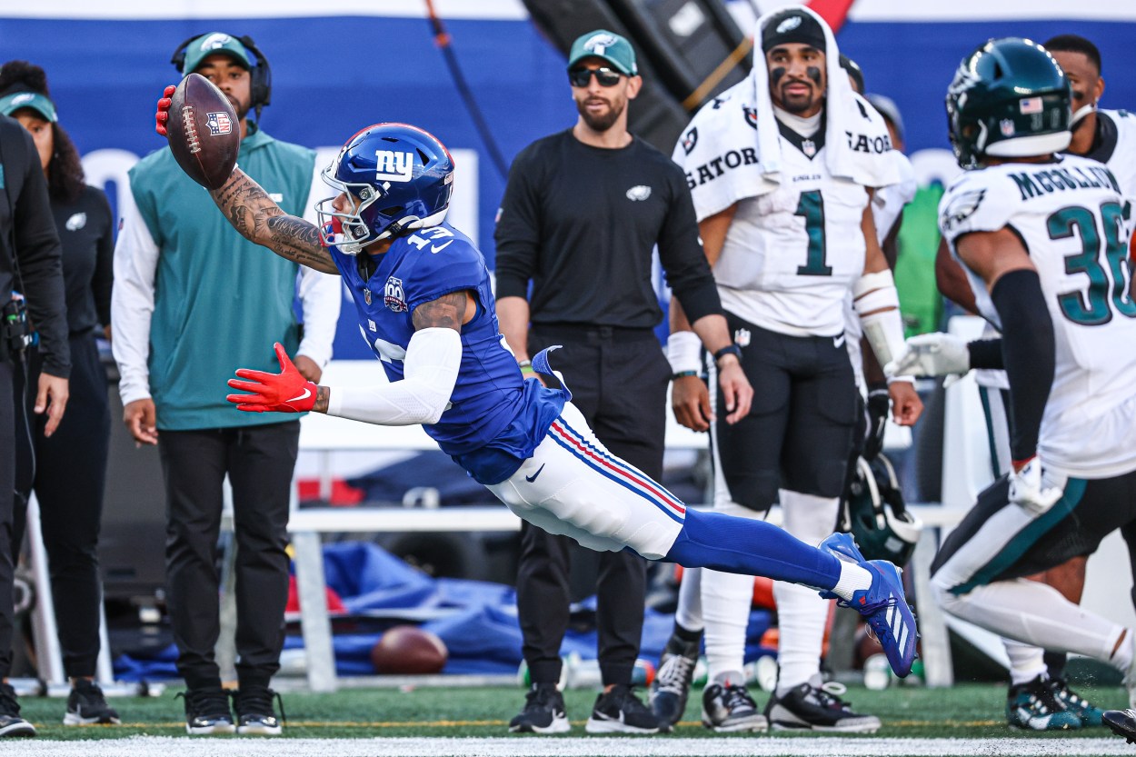 Oct 20, 2024; East Rutherford, New Jersey, USA; New York Giants wide receiver Jalin Hyatt (13) attempts to catch a pass in front of Philadelphia Eagles safety Tristin McCollum (36) during the second half at MetLife Stadium. Mandatory Credit: Vincent Carchietta-Imagn Images